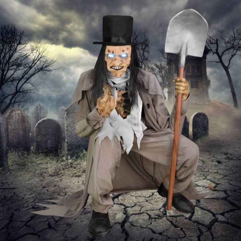 A life-size animated Halloween prop of a crouching grave digger
