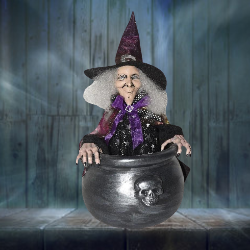 A realistic-looking Halloween decoration of a witch in a cauldron with bouncing motion