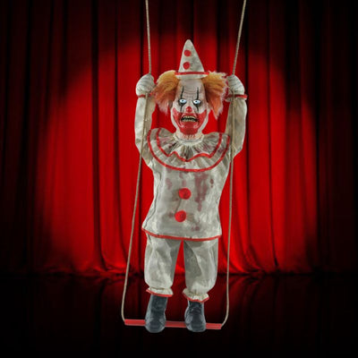 Colorful animated swinging happy clown doll with red nose and big smile