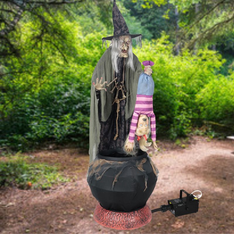 A spooky animated witch and kid prop with a fog machine for Halloween decoration