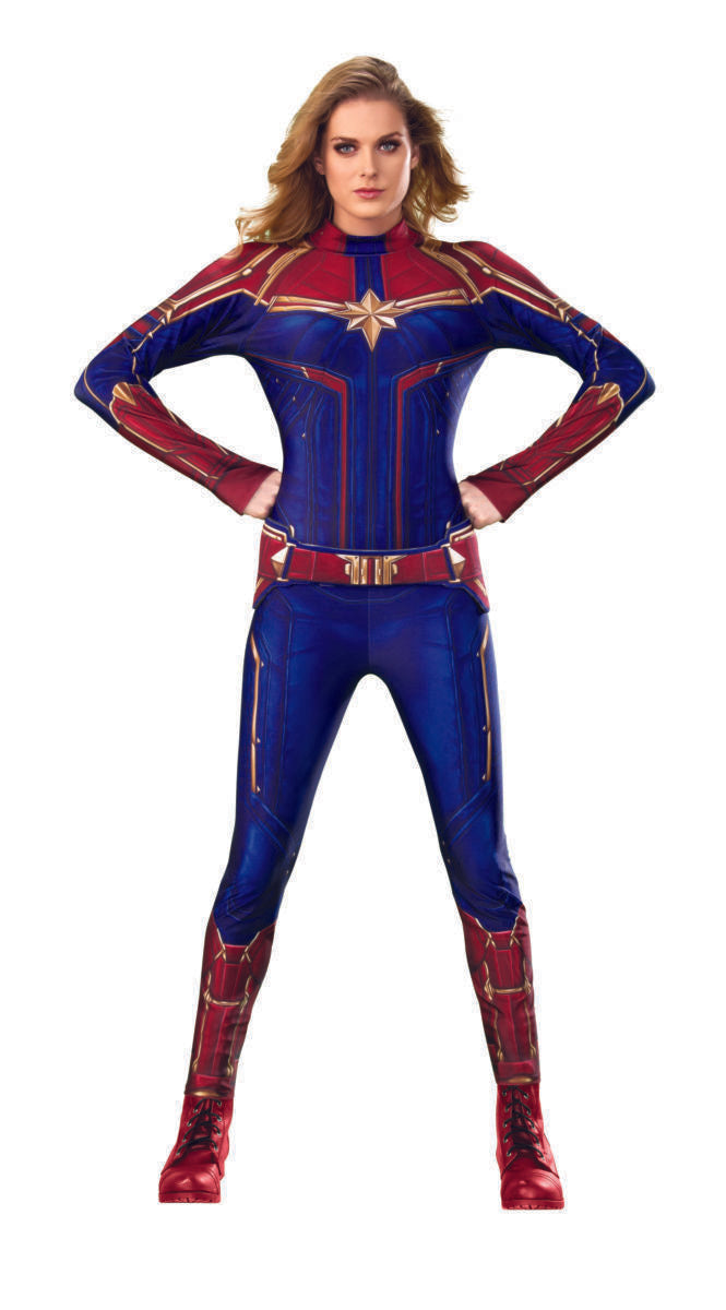 An adult wearing the Captain Marvel Deluxe Costume, with red, blue, and gold colors, striking a powerful pose