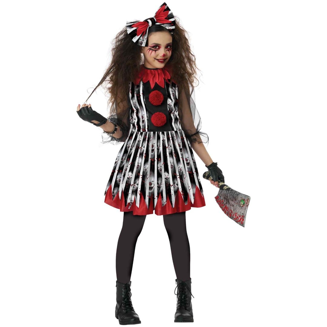 A child modeling a scary clown Halloween costume against a plain white background. The costume includes a black and white striped dress with red trim and red circular details, a matching red and black bow headband, black gloves, and black tights.