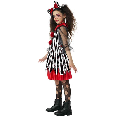 A child model wearing a Halloween costume consisting of a black and white skull-patterned dress with a red ruffled hem, sheer black mesh sleeves, black polka-dot tights, and black combat boots. The model also has a black and red bow in her hair and theatrical makeup.