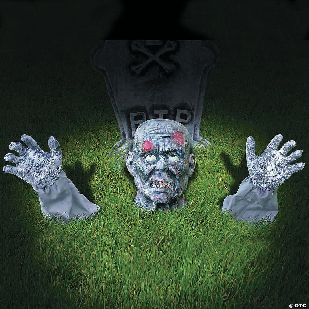 A detailed and realistic zombie groundbreaker Halloween decoration in a garden